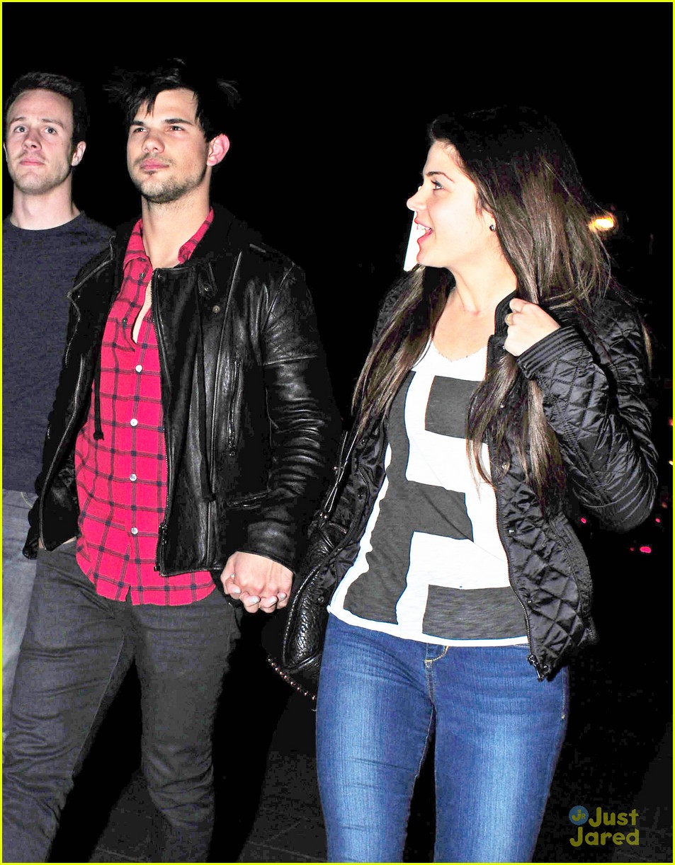 taylor lautner marie avgeropoulos matching jackets london 02